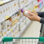 ady-looking-at-shampoo-in-grocery-store-